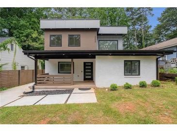 Modern two-story home featuring a painted white brick facade, a covered front porch and contemporary design at 1355 Lockwood Sw Dr, Atlanta, GA 30311
