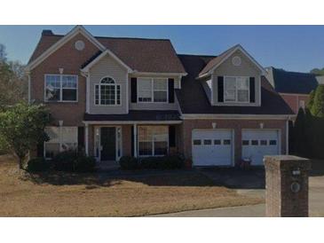 Charming two-story brick home with a two-car garage and well-maintained landscaping at 1090 Chapel Hill Drive Southeast, Lawrenceville, GA 30045