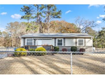 Charming single-story home featuring a covered front porch, neutral siding, and well-maintained landscaping at 1035 Stonewall Se Dr, Atlanta, GA 30315