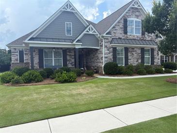 Beautiful stone and shake home with manicured lawn and charming curb appeal at 848 Rolling Nw Hl, Kennesaw, GA 30152