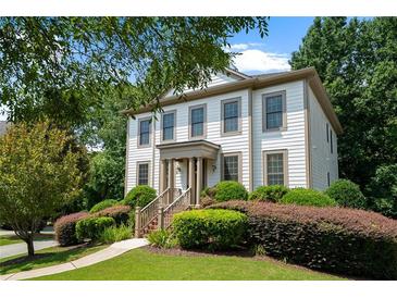 Charming two-story home with well-manicured landscaping and covered front porch at 1215 Renaissance Se Ct, Mableton, GA 30126