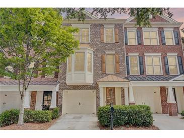 Beautiful brick townhome with attached garage and mature landscaping at 1160 Newpark View Pl # 8, Mableton, GA 30126
