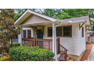 Charming front porch with decorative railing, inviting entrance to this lovely home at 91 Rogers Se St, Atlanta, GA 30317