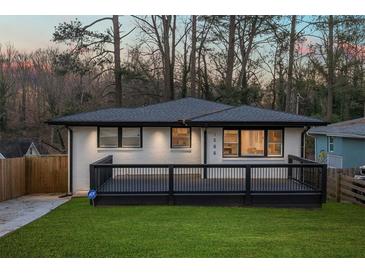 Charming renovated home featuring a deck, updated paint and new landscaping at 1566 Ezra Church Nw Dr, Atlanta, GA 30314