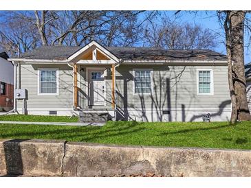 Charming home with updated siding, manicured lawn, and welcoming front porch, offering great curb appeal at 749 Bonnie Brae Sw Ave, Atlanta, GA 30310