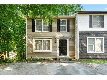 Charming two-story home featuring neutral siding, black shutters, and a welcoming front entrance at 2323 Wingfoot Pl, Decatur, GA 30035