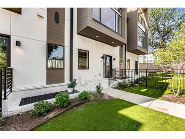 Modern home's inviting facade features manicured lawn, walkway, and stylish exterior design with plenty of greenery at 1099 North Ne Ave # 11, Atlanta, GA 30307