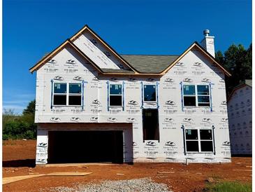 Exterior view of a two-story home under construction, showcasing the facade and architectural design at 500 Charleston Pl, Villa Rica, GA 30180