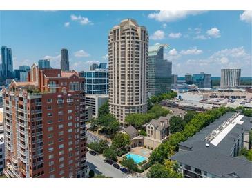 Stunning aerial view of the Oaks Buckhead community with high-rise buildings and a refreshing pool at 3475 Oak Valley Ne Rd # 910, Atlanta, GA 30326