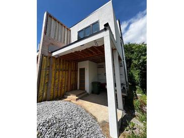 Under-construction home exterior featuring a modern design with a partial view of the entrance and building materials at 314 Fortune Ne St # B, Atlanta, GA 30312
