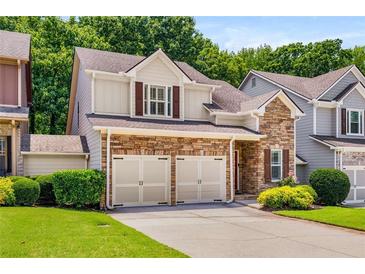 Charming two-story home featuring a stone facade and a two-car garage at 1024 Brownstone Dr # 2, Marietta, GA 30008
