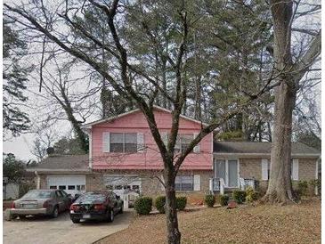 Charming two-story home with a brick facade and a well-manicured front yard at 3919 Bressler Cir, Decatur, GA 30035