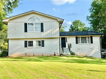 Charming two-story home with a well-manicured lawn and classic curb appeal at 5347 Ocarol Ct, Stone Mountain, GA 30088