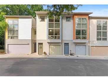 Contemporary townhome exterior featuring a private garage and modern architectural details at 1346 Peter Haughton Nw Way # 2, Atlanta, GA 30318