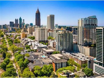 Stunning aerial view of Atlanta skyline featuring lush green trees and modern architecture at 850 Piedmont Ne Ave # 1206, Atlanta, GA 30308