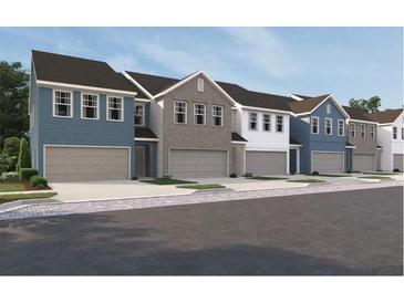 Charming exterior view of colorful townhomes with attached garages and traditional architectural details at 1115 Lockhart Way, Douglasville, GA 30135