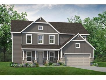 Charming two-story home with stone accents, covered front porch and a two-car garage at 149 Willow Bend Rd, Hiram, GA 30141