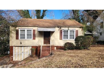 Charming one-story home with siding and a covered front entry, showcasing its classic curb appeal at 1235 Westboro Sw Dr, Atlanta, GA 30310