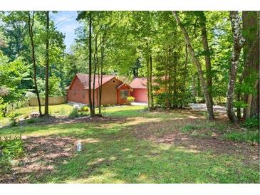 Charming single-Gathering home with mature trees creating a private, secluded yard at 2945 Cardinal Lake Cir, Duluth, GA 30096