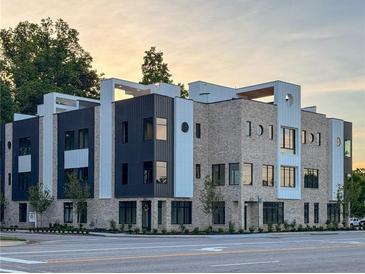 Modern building with striking architectural features, including brick, black metal, and white accents at 3960 Clairmont Rd # 2, Chamblee, GA 30341