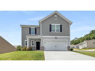 Charming two-story home features gray siding, black shutters, and a well-maintained front yard at 198 Colbury St, Villa Rica, GA 30180