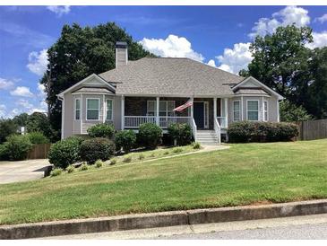 Charming single-Gathering home with a well-maintained lawn and welcoming front porch at 493 Kyles Cir, Hiram, GA 30141