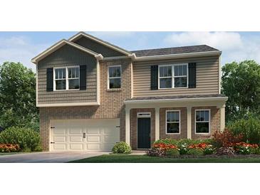 Charming two-story home with brick accents, complemented by manicured landscaping and a welcoming entrance at 112 Crooked Lake Park, Villa Rica, GA 30180