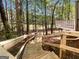Stairway down to the backyard featuring lush greenery and landscaping at 819 Bermuda Run, Woodstock, GA 30189