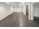 Large basement area with tiled floors and neutral walls, perfect for entertainment or relaxation at 819 Bermuda Run, Woodstock, GA 30189