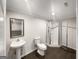 Bathroom featuring tile floors, a toilet, a vanity sink and a glass door shower at 819 Bermuda Run, Woodstock, GA 30189