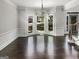 Bright dining room featuring hardwood floors, and a bay window with a view of the neighborhood at 819 Bermuda Run, Woodstock, GA 30189