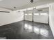 Garage with epoxy floors, white walls, and two garage doors at 819 Bermuda Run, Woodstock, GA 30189