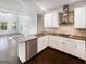 Spacious kitchen featuring stainless steel appliances, white cabinets and dark countertops at 819 Bermuda Run, Woodstock, GA 30189