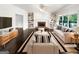 Bright living room features a fireplace, built-in shelving, hardwood flooring, and neutral decor at 819 Bermuda Run, Woodstock, GA 30189