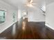 Open-concept living room with hardwood floors and an abundance of natural light at 819 Bermuda Run, Woodstock, GA 30189