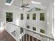 Open concept loft with a ceiling fan, hardwood floors, large windows and lots of natural light at 819 Bermuda Run, Woodstock, GA 30189