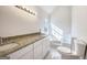 Bright bathroom features a granite countertop and soaking tub at 225 Woodfield Ct, Mcdonough, GA 30253