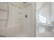 Clean, bright bathroom features tiled shower and soaking tub at 225 Woodfield Ct, Mcdonough, GA 30253