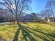 Charming two-story home with inviting front porch and mature trees at 225 Woodfield Ct, Mcdonough, GA 30253