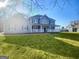 Charming two-story home features a welcoming front porch and well-manicured lawn at 225 Woodfield Ct, Mcdonough, GA 30253