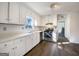 This kitchen includes stainless steel appliances and white cabinetry at 225 Woodfield Ct, Mcdonough, GA 30253
