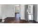 Bright kitchen with stainless steel refrigerator and view into dining area at 225 Woodfield Ct, Mcdonough, GA 30253