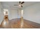 Bright primary bedroom featuring hardwood floors, a ceiling fan and ensuite bathroom at 3159 Nursery Se Rd, Smyrna, GA 30082