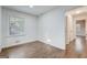 Bedroom featuring hardwood floors and a window with natural light at 3159 Nursery Se Rd, Smyrna, GA 30082