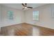 Bedroom featuring hardwood floors and two windows with natural light at 3159 Nursery Se Rd, Smyrna, GA 30082