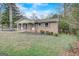 Charming brick home with a well-maintained front yard, mature trees, and updated windows at 3159 Nursery Se Rd, Smyrna, GA 30082