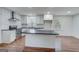 Bright kitchen with white cabinets, subway tile backsplash, stainless steel appliances, and an island at 3159 Nursery Se Rd, Smyrna, GA 30082