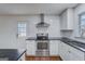 Updated kitchen featuring stainless steel appliances and a classic subway tile backsplash at 3159 Nursery Se Rd, Smyrna, GA 30082