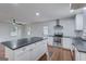 Open kitchen with a large island, stainless steel appliances, and classic white cabinetry at 3159 Nursery Se Rd, Smyrna, GA 30082