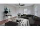 Bright living room featuring modern furnishings, a stylish rug, and ample natural light streaming through the windows at 3159 Nursery Se Rd, Smyrna, GA 30082